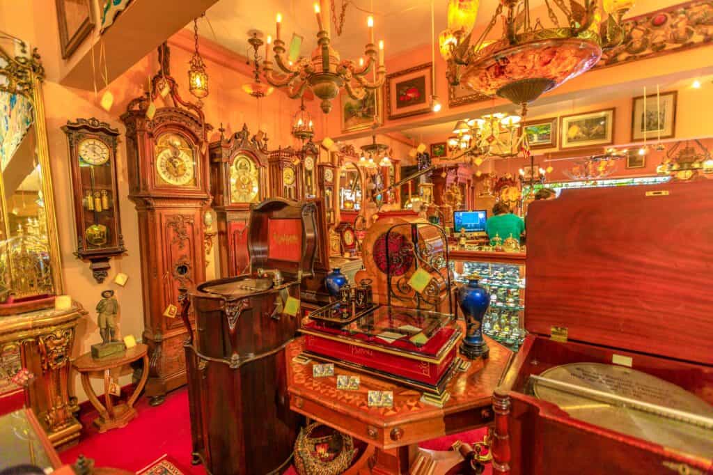 Vibrant antique shop in Palm Springs, filled with vintage clocks and collectibles, a cozy stop during a nostalgic babymoon.