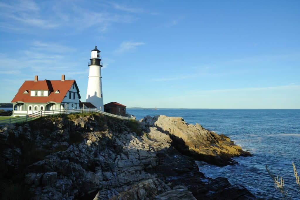 One of the best babymoon locations in the USA, the Portland Head Light in Maine offers serene ocean views and a historic lighthouse setting for expecting couples