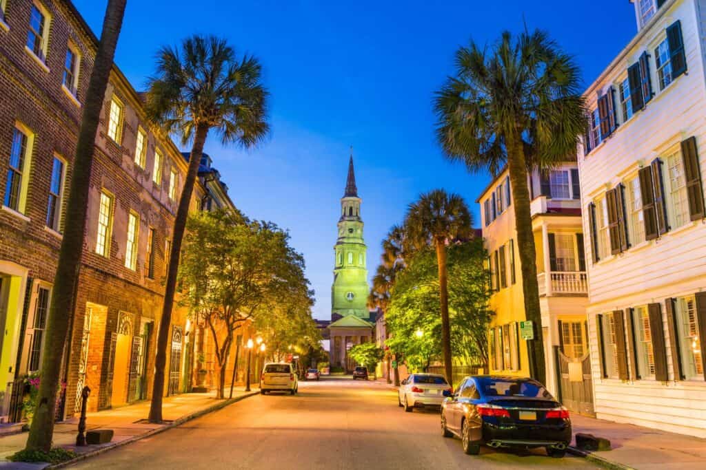 St. Philip's Church in Charleston, South Carolina, a romantic spot for a babymoon, captured at twilight with its charming streets and historic Southern architecture
