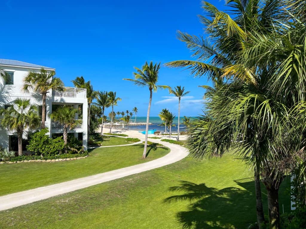 Luxurious Islamorada Key resort surrounded by lush palms with a view of the clear blue ocean, an idyllic destination for a babymoon retreat