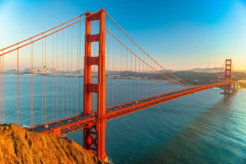 The Golden Gate Bridge at sunset, a landmark experience for couples celebrating their upcoming arrival with a babymoon in California