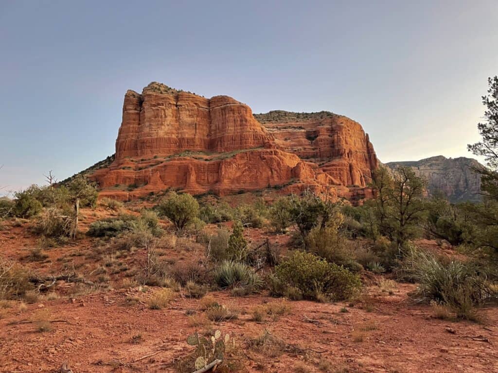 Iconic red rock formations standing majestically under the vast skies of Sedona, a natural wonder to explore on a babymoon
