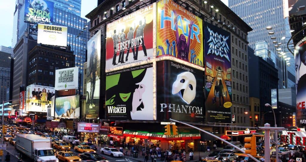 Busy New York Time square with billboards for broadway shows