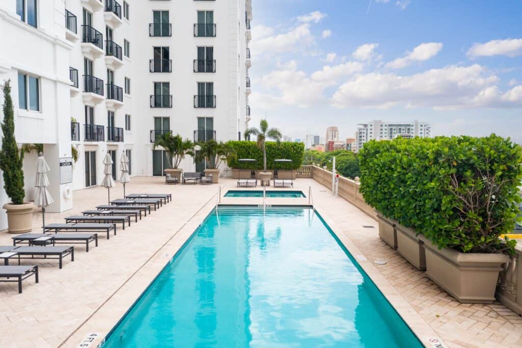 A nice long clear rooftop swimming pool in Miami over looking the city